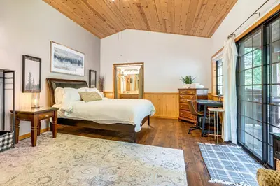 a bedroom with a bed and a desk at Fire Pit, Gazebo and Grill Family Cabin in Arnold! in Arnold