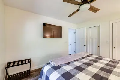 a bedroom with a bed and a ceiling fan at Ski, Hike and Fish Mtn-View Gem with Deck in Tuolumne in Tuolumne