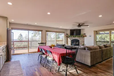 a living room with a table and a couch at Ski, Hike and Fish Mtn-View Gem with Deck in Tuolumne in Tuolumne