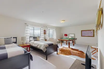 a bedroom with two beds and a desk at Bear-foot Retreat in Incline Village