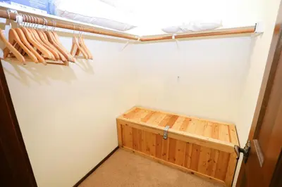 a room with a closet with a wooden bed in it at Updated Mammoth condo on Red line in Mammoth Lakes