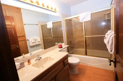 a bathroom with a sink and a shower and a toilet at Updated Mammoth condo on Red line in Mammoth Lakes