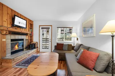 a living room with a couch and a fireplace at Kirkwood Retreat - 2 Bedroom Condo condo in Kirkwood