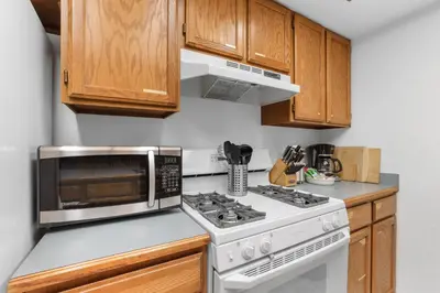 a kitchen with a microwave and a stove at Kirkwood Retreat - 2 Bedroom Condo condo in Kirkwood