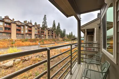 a balcony with chairs and a view of condos at Kirkwood Retreat - 2 Bedroom Condo condo in Kirkwood