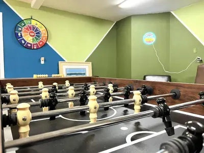 a room with a dart board and a room with a room at Heaven Heights - HotTub, Pet Friendly, EV Outlet, Pool Table, Game Room, BBQ, FirePit, Library in Oakhurst