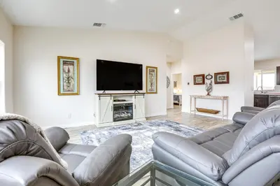 a living room with couches and a flat screen tv at On-Site Winery Rural Plymouth Getaway! in Plymouth