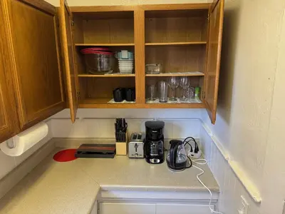 a kitchen counter with a coffee maker on the counter at Midtown Hideaway 1 BR Nest in Reno