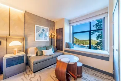 a living room with a couch and a window at Updated Pet Friendly Monache Studio with Views! in Mammoth Lakes