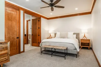 a bedroom with a bed and a ceiling fan at Obsidian 210 in Mammoth Lakes