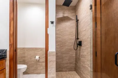 a shower with a glass door in a bathroom at Obsidian 210 in Mammoth Lakes