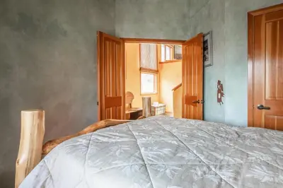 a bedroom with a bed and a window at XXL Snowcreek #747 - 5 Bedroom 4 Bathroom Sleeps 12 Pet Friendly, Amazing Mountain Views in Mammoth Lakes