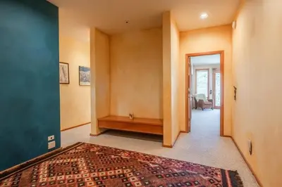 a hallway with a room with a rug on the floor at XXL Snowcreek #747 - 5 Bedroom 4 Bathroom Sleeps 12 Pet Friendly, Amazing Mountain Views in Mammoth Lakes
