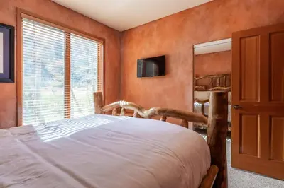 a bedroom with a bed and a window at XXL Snowcreek #747 - 5 Bedroom 4 Bathroom Sleeps 12 Pet Friendly, Amazing Mountain Views in Mammoth Lakes