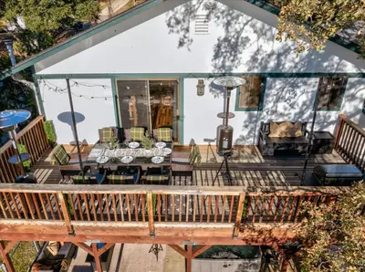 an overhead view of a deck with a table and chairs at Sequoia's Dream with Mountain View, Spa, Heated Floor, Bar, Cinema! in Oakhurst