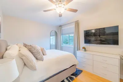 a bedroom with a bed and a ceiling fan at Modern 3-Bedroom Escape in Northwest Reno in Reno