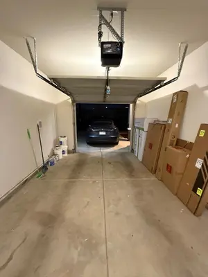 a parking garage with a car parked in it at 5 Min Walk to UCD Med Ctr - Stylish New Build Home in Sacramento