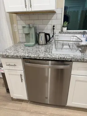 a kitchen counter with a mixer on a counter top at 5 Min Walk to UCD Med Ctr - Stylish New Build Home in Sacramento