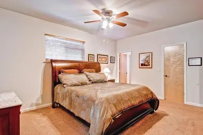 a bedroom with a bed with a ceiling fan at Eagles Nest in Yosemite West