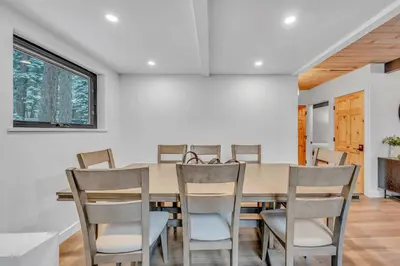 a dining room with a table and chairs at Tahoe City Vacation Rental with Fireplace and Deck in Tahoe City