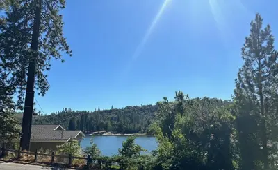 a view of a lake from a house at Lake View Cabin Private Dock Free Night Special in Bass Lake