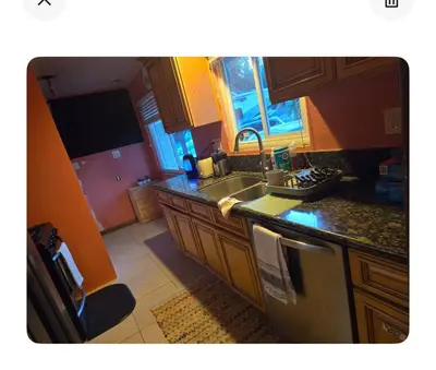 a kitchen with a sink and a stove at Charming peaceful stay in Sacramento