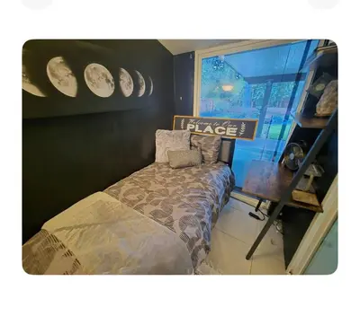 a bedroom with a bed and a sign that reads place at Charming peaceful stay in Sacramento