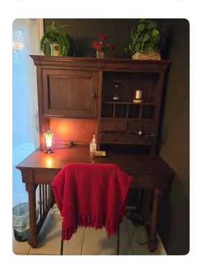 a wooden desk with a red blanket on it at Charming peaceful stay in Sacramento