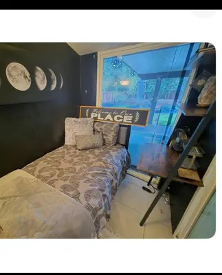 a bedroom with a bed and a sign that reads blaze at Charming peaceful stay in Sacramento