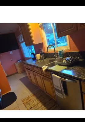 a kitchen with a sink and a counter top at Charming peaceful stay in Sacramento