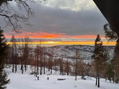 a group of people skiing in the snow at sunset at Shaver Lake, 4 BDR HOT TUB Misty Mountain Retreat in Shaver Lake