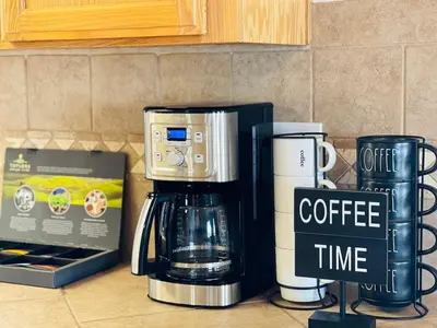 a coffee maker and a box on a kitchen counter at Shaver Lake, 4 BDR HOT TUB Misty Mountain Retreat in Shaver Lake