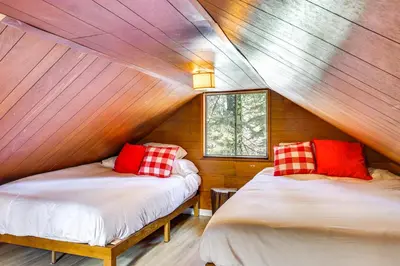a bedroom with two beds in a wooden house at Less Than 2 Blocks to Lake Tahoe Family Home Near Skiing in Homewood