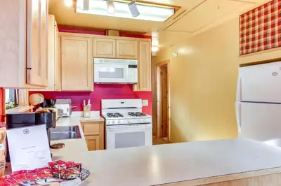 a kitchen with a white stove and a microwave at Less Than 2 Blocks to Lake Tahoe Family Home Near Skiing in Homewood
