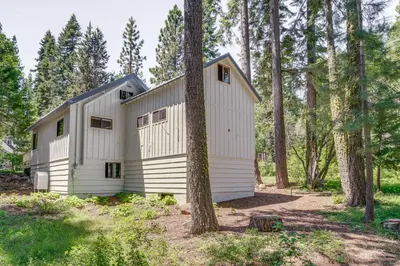 a white house in the woods with trees at Less Than 2 Blocks to Lake Tahoe Family Home Near Skiing in Homewood