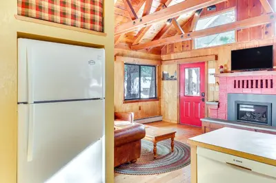 a kitchen with a refrigerator and a living room at Less Than 2 Blocks to Lake Tahoe Family Home Near Skiing in Homewood
