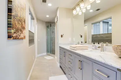 a bathroom with a double sink and a large mirror at Mtn-View Haven with Hot Tub! 28 Mi to Mt Rose Ski in Sparks