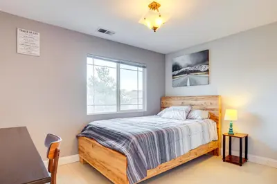 a bedroom with a bed and a window at Mtn-View Haven with Hot Tub! 28 Mi to Mt Rose Ski in Sparks