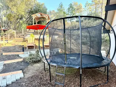 a swing set in a yard with a playground at The Ultimate Mountain Retreat close Yosemite and Bass Lake in Oakhurst
