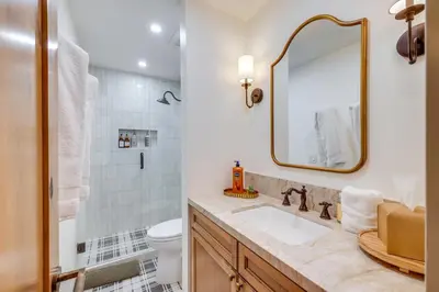a bathroom with a sink and a mirror at 8 Mi to Northstar Slopes Tahoe Gem with Fireplace in Kings Beach