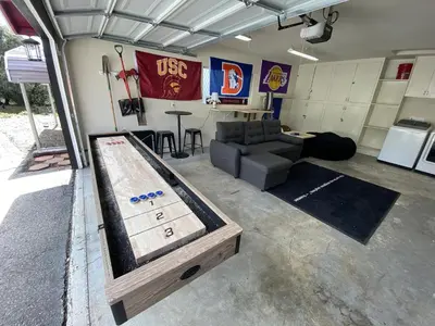 a room with a pool table in a garage at The Firelight Lodge in Oakhurst