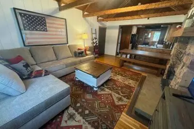 a living room with a couch and an american flag at Spacious Tahoe Hot Tub and Beach in Kings Beach