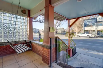 an outside view of a building with a porch at Steps to Truckee River Walk Rose Cottage in Reno