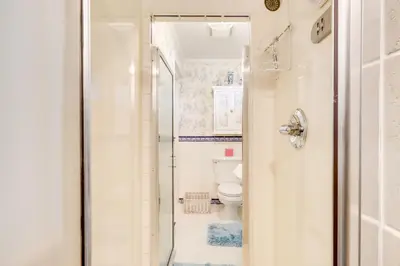 a bathroom with a shower and a toilet at Close to Midtown! Cozy Reno River Cottage in Reno