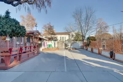 a street with a fence and a building at Close to Midtown! Cozy Reno River Cottage in Reno