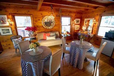 a living room with two tables and a couch at Elliott House Boutique Inn in Shaver Lake