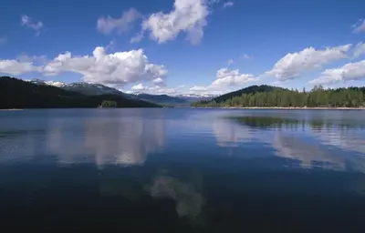 a large body of water with mountains in the background at Elliott House Boutique Inn in Shaver Lake