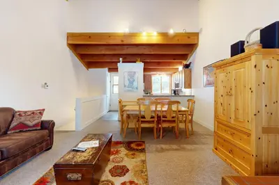 a living room with a couch and a table at Getaway at Gold Bend in Ponderosa Fairway Estates