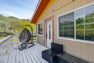 a porch with a bench and a chair on a house at Mtn-View Weldon Home Walk to Pacific Crest Trail in Weldon