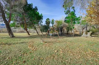 a swing set in a park with trees at Mtn-View Weldon Home Walk to Pacific Crest Trail in Weldon